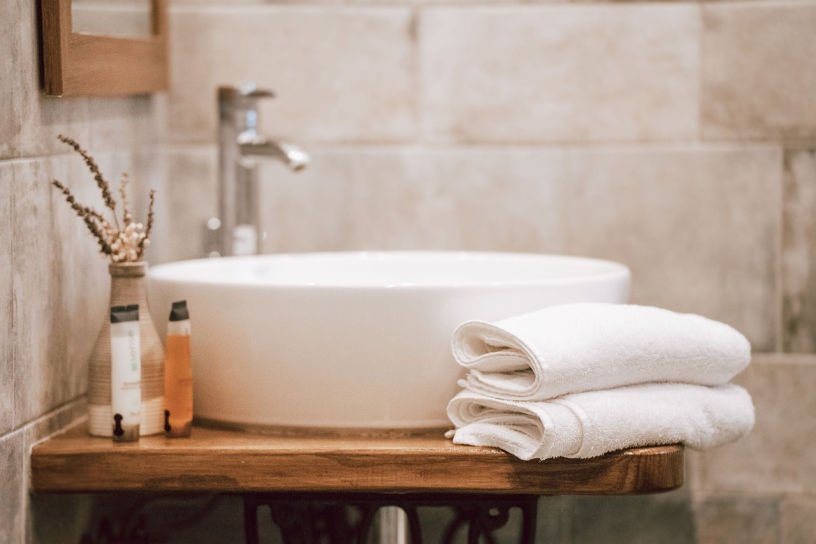 bathroom sink and towels neat and tidy