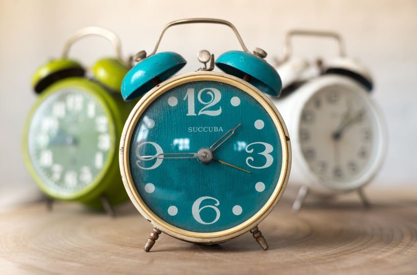 vintage alarm clocks for sale in a charity shop